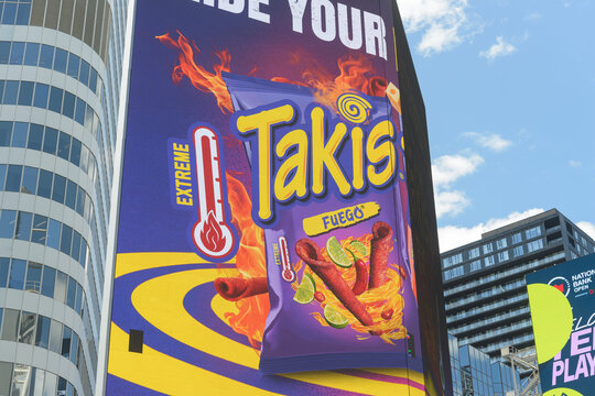 digital billboard at Sankofa Square featuring Takis Extreme Fuego (Barcel, Grupo Bimbo) chips, Toronto
