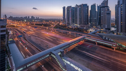 Aerial top view to Sheikh Zayed road near Dubai Marina and JLT night to day timelapse, Dubai.