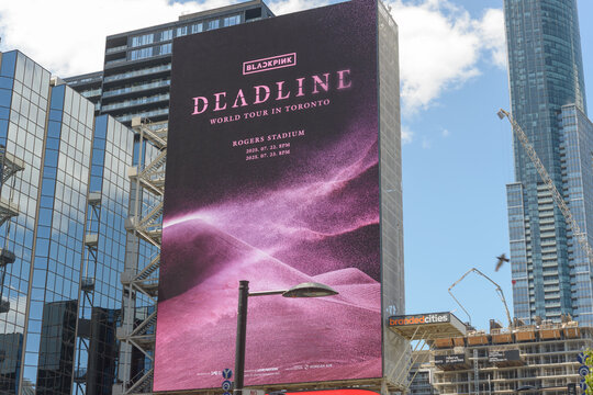 digital billboard with concert promotion for BLACKPINK, Deadline World Tour, Sankofa Square, Toronto