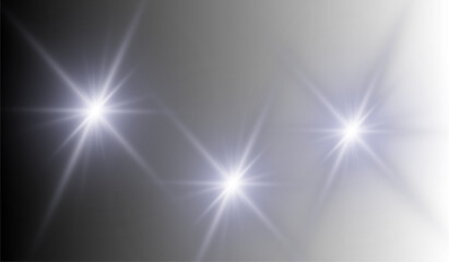 Three bright stars shine in the night sky with radiating light and a soft gradient background effect present