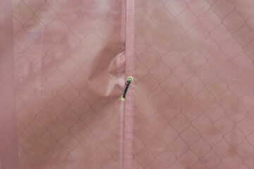 netting with grommets and black zip tie outdoors  