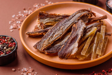 Dried salted fish as snacks or jerky, seafood as slices. Dried seafood snacks