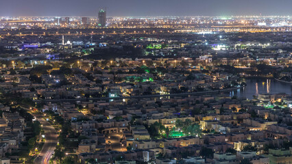 Aerial view to villas and houses with Golf course night timelapse