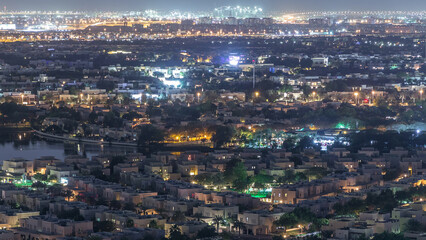 Aerial view to villas and houses with Golf course night timelapse