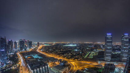 Fototapeta premium Jumeirah Lake Towers residential district aerial night timelapse near Dubai Marina