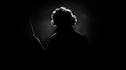 beethoven as conductor raising his baton silhouette on black background
