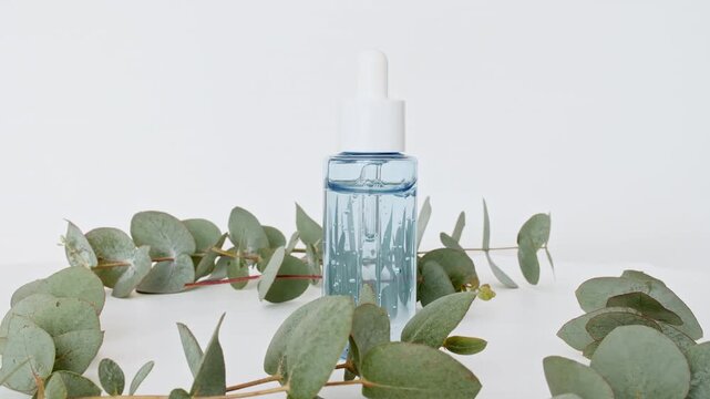 Organic Eucalyptus essence oil. Cosmetic bottles with pipette for serum, extract and emulsion. Cosmetics based on natural ingredients. Spa the concept of skin care. High quality 4k footage