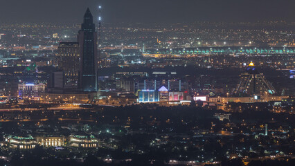 Aerial view of neighborhood Deira and Dubai creek with typical old and modern buildings night timelapse.
