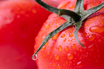 Macro close-up of a fresh red tomato with water droplets and stem detail. Perfect for food, health, organic produce, and cooking themes.