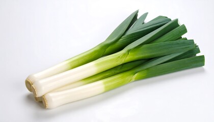 Fresh, vibrant leeks arranged on a plain white background