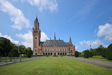 Exterior of The Hague's Peace Palace against a blue sky