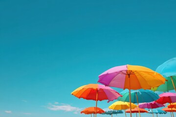 Close-up of colorful beach umbrellas against a blue sky A summer vacation concept, with copy space for text a banner with copy space and web explosion elements Generative AI