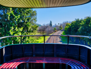 View of train tracks and Franschhoek valley from the back of a train, South Africa