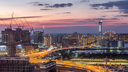 Fototapeta premium Palm Jumeirah Highway bridge aerial day to night timelapse. Dubai, United Arab Emirates