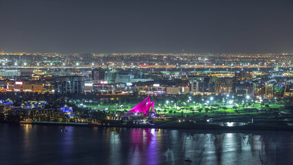 The rhythm of the city with lights from buildings and illuminated roads aerial timelapse