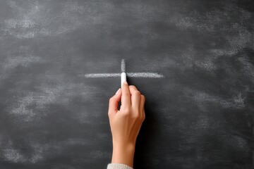 Woman's hand drawing white chalk cross symbol on a dark blackboard for educational purposes on transparent background