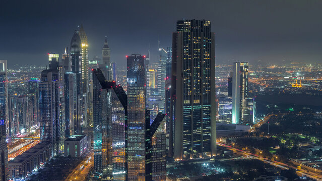Dubai International Financial Centre district with modern skyscrapers night timelapse