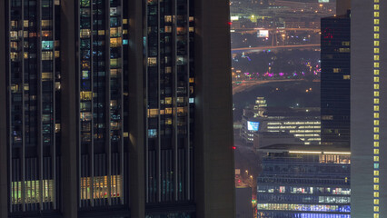 Dubai International Financial Centre district with modern skyscrapers night timelapse