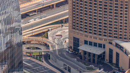 Dubai downtown street with busy traffic and skyscrapers around timelapse.