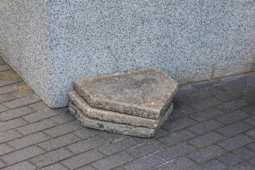 Worn concrete steps with weathered edges and rough texture showing signs of frequent pedestrian use