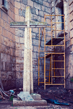 Death of faith and spiritual crisis. Abandoned cross and scaffolding as a metaphor for the decline of religion, deconstruction of beliefs, modern Europe, symbolism