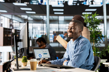 Thrilled confident CEO in business attire celebrates a victorious milestone, express enthusiasm at...