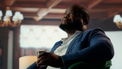 High society billionaire drinking whiskey at the classy luxurious social club, enjoying a gathering...