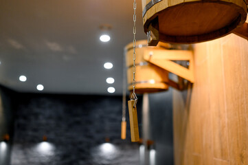 Wooden buckets for dousing with cold water, hanging on the wall