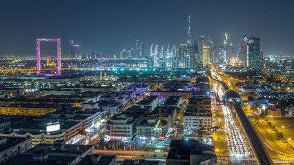 Fototapeta premium Dubai skyline with beautiful city center lights and Sheikh Zayed road traffic night timelapse, Dubai, United Arab Emirates