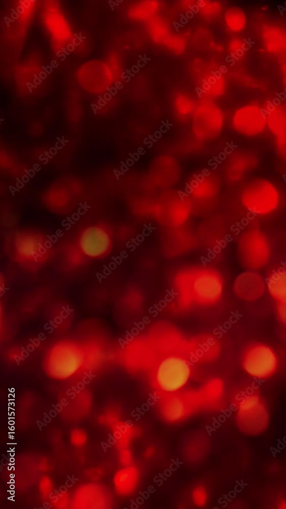 Wall mural vertical red lights carousel rainfall 4k loop features defocused glowing lights falling down the scr
