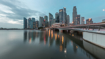 Esplanade bridge and downtown core skyscrapers in the background Singapore night to day timelapse
