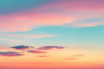 A serene sky at sunset with soft pastel hues of pink, orange, and blue blending seamlessly with scattered clouds.