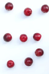 Plums on a white background, top view, free space, summer