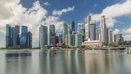 Obraz premium Business Financial Downtown City and Skyscrapers Tower Building at Marina Bay timelapse hyperlapse, Singapore,