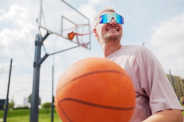 Enjoying a sunny day of basketball with friends in the park