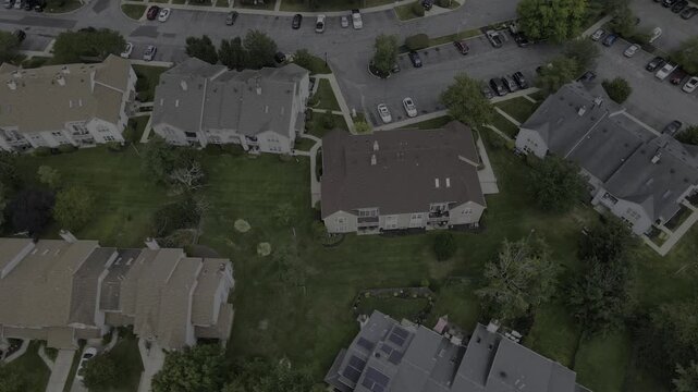 Drone orbits condos and spirals up to reveal suburban neighborhood in New Jersey, USA
