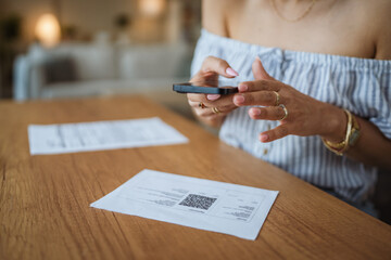 close up on woman have contactless payment scan invoice on cellphone
