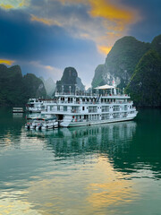 Cruise ship at anchor at sunset. Halong Bay, Vietnam