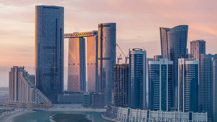 Buildings on Al Reem island in Abu Dhabi timelapse from above.