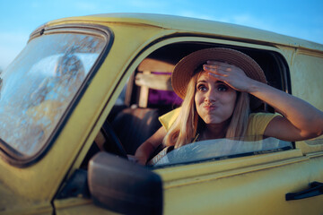 
Funny Woman Driving in an Old Car Feeling Stressed Out 

Driver having problem starting the engine...