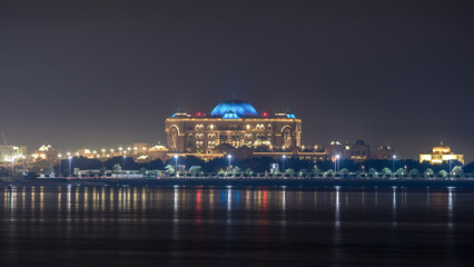 Obraz premium Emirates Palace illuminated at night timelapse, Abu Dhabi, United Arab Emirates