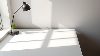 A minimalist workspace with a clean desk surface, highlighted by subtle shadows and soft side window light.