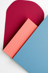 Abstract geometric composition with overlapping shapes in red pink and blue