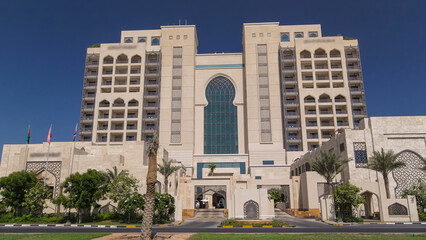 Building of luxurious 5-star hotel in Ajman timelapse hyperlapse nestled near the turquoise waters of Arabian Gulf.