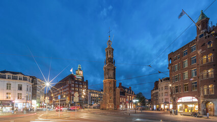 Naklejka premium Munttoren tower and flowers market. Panoramic day to night timelapse hyperlapse of Amsterdam city center. Netherlands