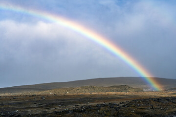 Fototapeta premium wallpaper of a perfect rainbow in the Cotopaxi national park
