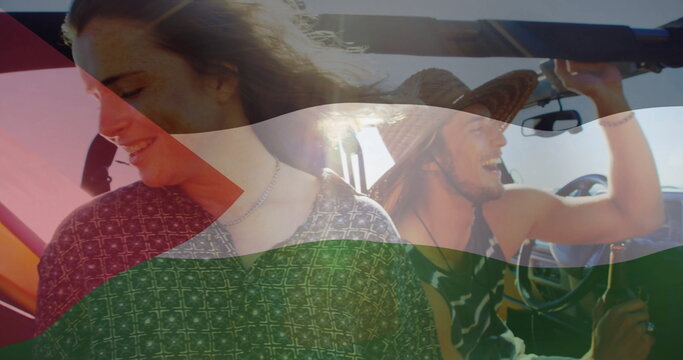 Laughing two friends riding open-top dune buggy on sunlit desert road, with tricolor flag overlay - Powered by Adobe