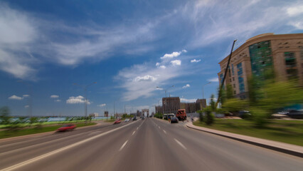 Car drives on street Traffic over the wide boulevards of Astana timelapse hyperlapse drivelapse in Kazakhstan