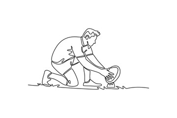 Single one line drawing active male rugby player wearing team uniform, training at sport field, kneeling and placing rugby ball for kick. Modern continuous line draw design graphic vector illustration