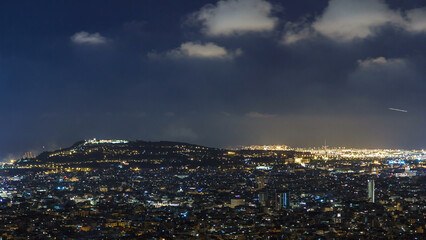 View of Barcelona timelapse, the Mediterranean sea, montjuic mountain from Bunkers Carmel. Catalonia, Spain.